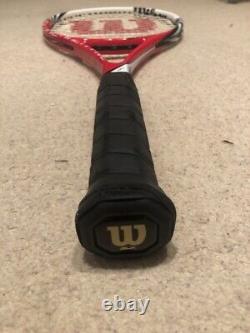 Red and white Wilson Tennis racket six one ninety five BLX