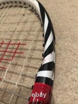 Red and white Wilson Tennis racket six one ninety five BLX